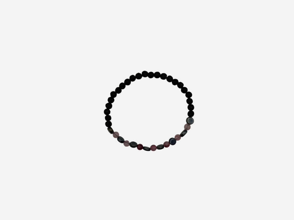 SPARQ beaded stretch bracelet with matte black lava beads, pink quartz, red jasper, and blue-grey stones. Elastic design.