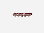SPARQ pink seed bead stretch bracelet with clear crystal bow charms. Elastic design for comfortable wear.