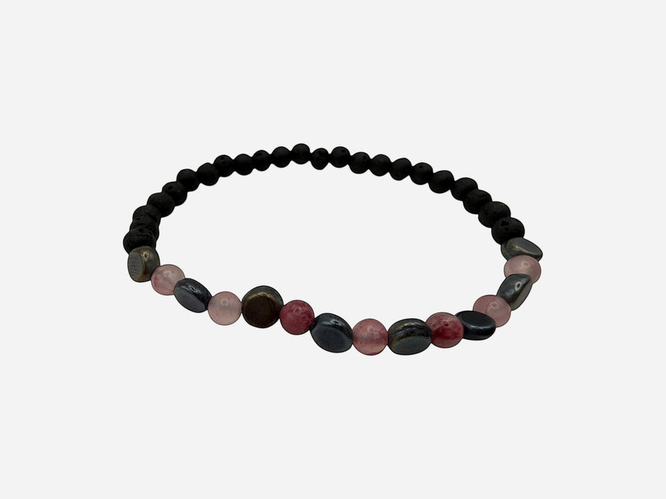 SPARQ beaded stretch bracelet with matte black lava beads, pink quartz, red jasper, and blue-grey stones. Elastic design.