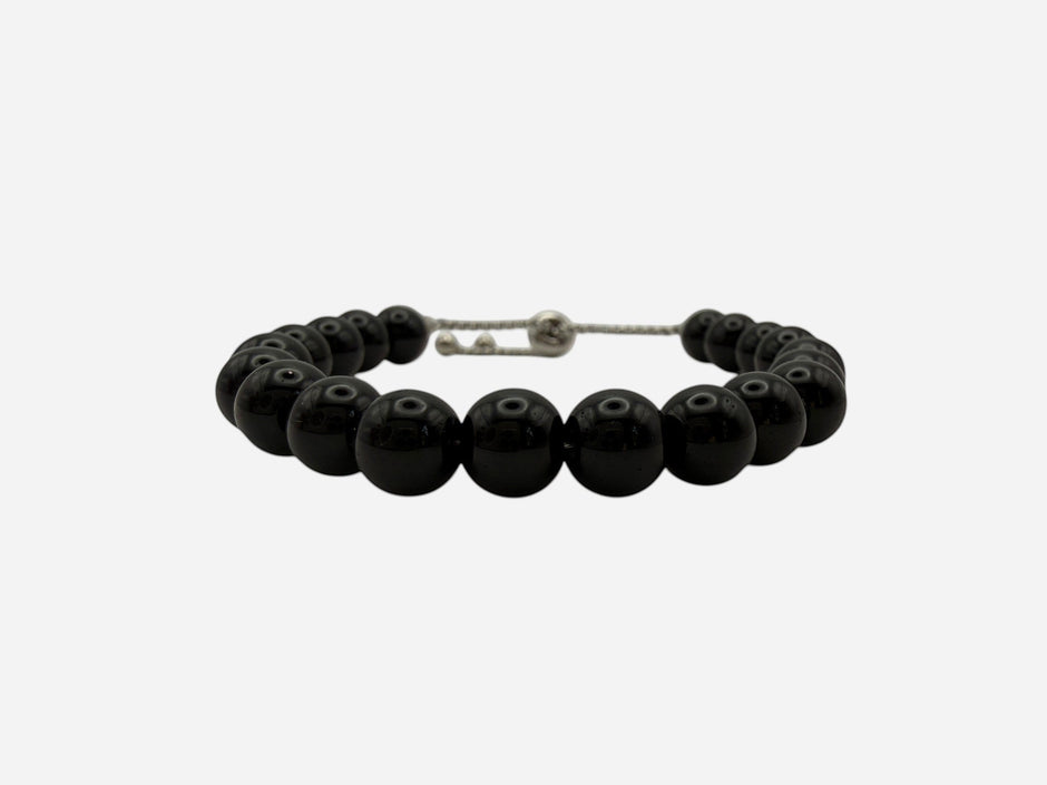 SPARQ black beaded bracelet with adjustable stainless steel chain, minimalist design.