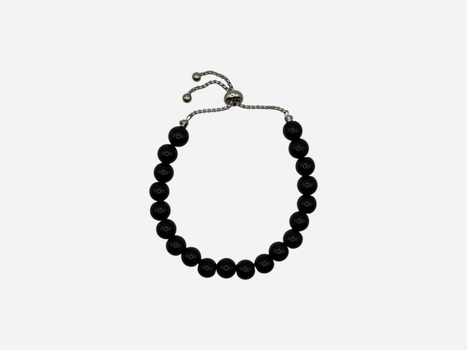 SPARQ black beaded bracelet with adjustable stainless steel chain, minimalist design.