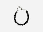 SPARQ black beaded bracelet with adjustable stainless steel chain, minimalist design.