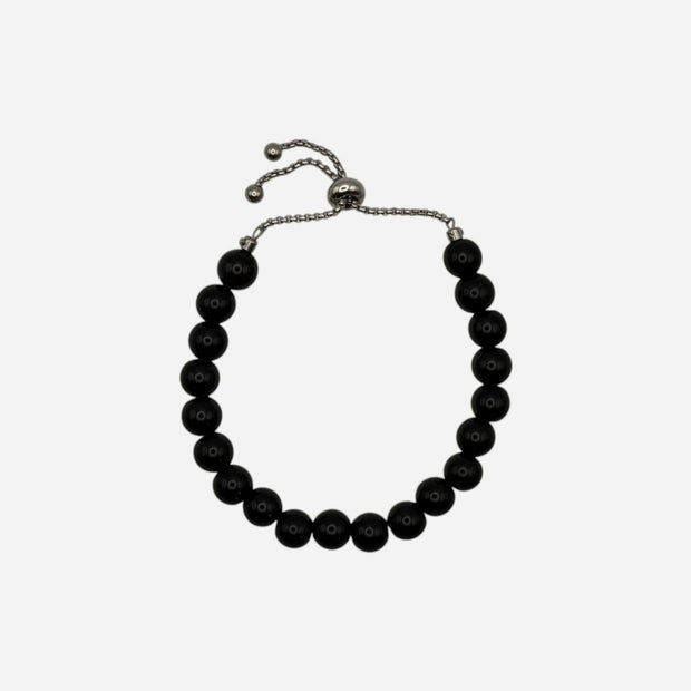SPARQ black beaded bracelet with adjustable stainless steel chain, minimalist design.