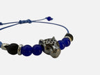 SPARQ blauwe kralenarmband voor dames met zilverkleurige luipaardbedel en verstelbaar blauw koord