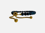 SPARQ verstelbare kralenarmband van blauwe tijgeroog met luxe goudkleurige details en schuifsluiting
