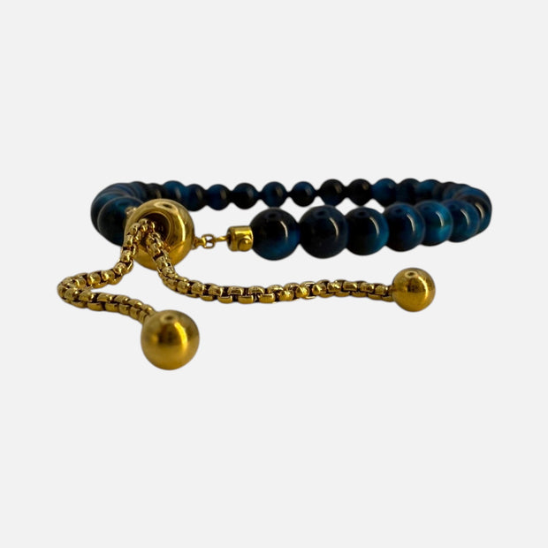 SPARQ verstelbare kralenarmband van blauwe tijgeroog met luxe goudkleurige details en schuifsluiting