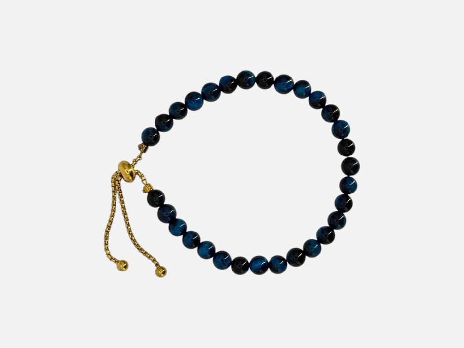 SPARQ verstelbare kralenarmband van blauwe tijgeroog met luxe goudkleurige details en schuifsluiting