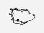 SPARQ dubbele zilverkleurige schakelarmband met ronde bedels en een stevige karabijnsluiting op een witte achtergrond.