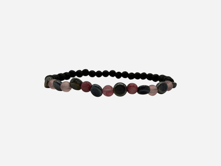 SPARQ beaded stretch bracelet with matte black lava beads, pink quartz, red jasper, and blue-grey stones. Elastic design for comfortable fit.