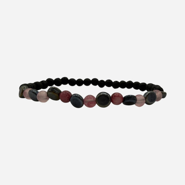 SPARQ beaded stretch bracelet with matte black lava beads, pink quartz, red jasper, and blue-grey stones. Elastic design for comfortable fit.