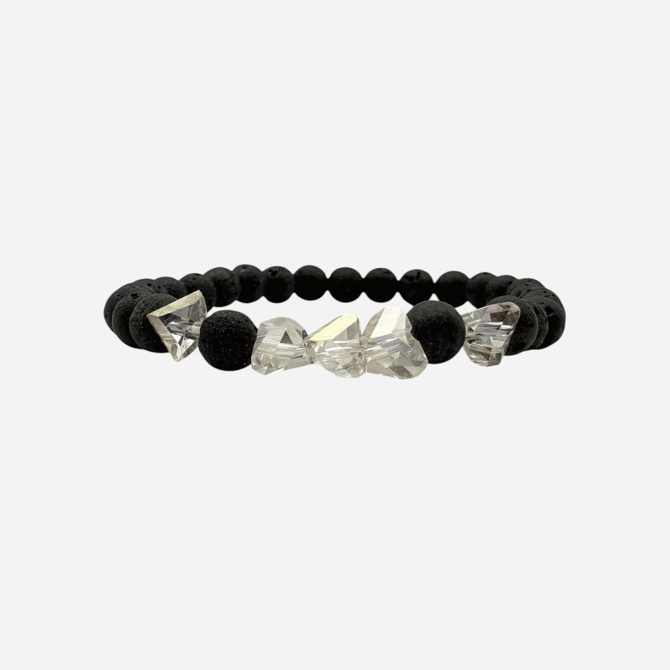SPARQ black lava stone bracelet with clear faceted crystal accents on an elastic band.