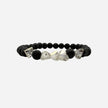 SPARQ black lava stone bracelet with clear faceted crystal accents on an elastic band.
