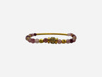 SPARQ pink and deep red natural stone beaded stretch bracelet with gold bar and rhinestone center.