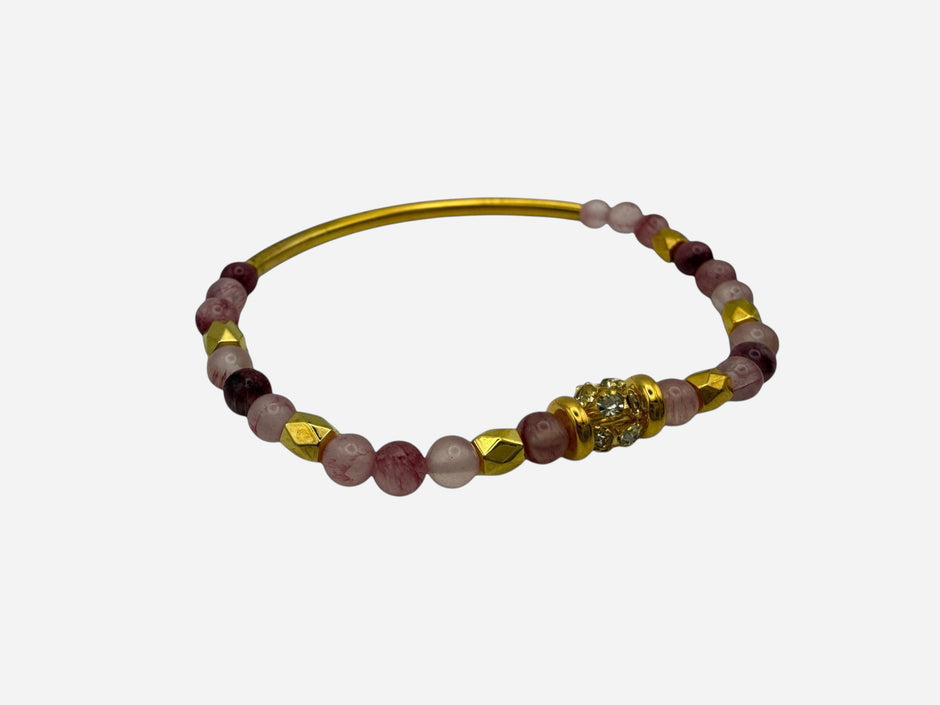 SPARQ pink and deep red natural stone beaded stretch bracelet with gold bar and rhinestone accent.