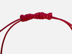 SPARQ handgemaakte roze kralenarmband met verstelbare schuifknoop en opvallende schelpbedel voor een bohemian look.