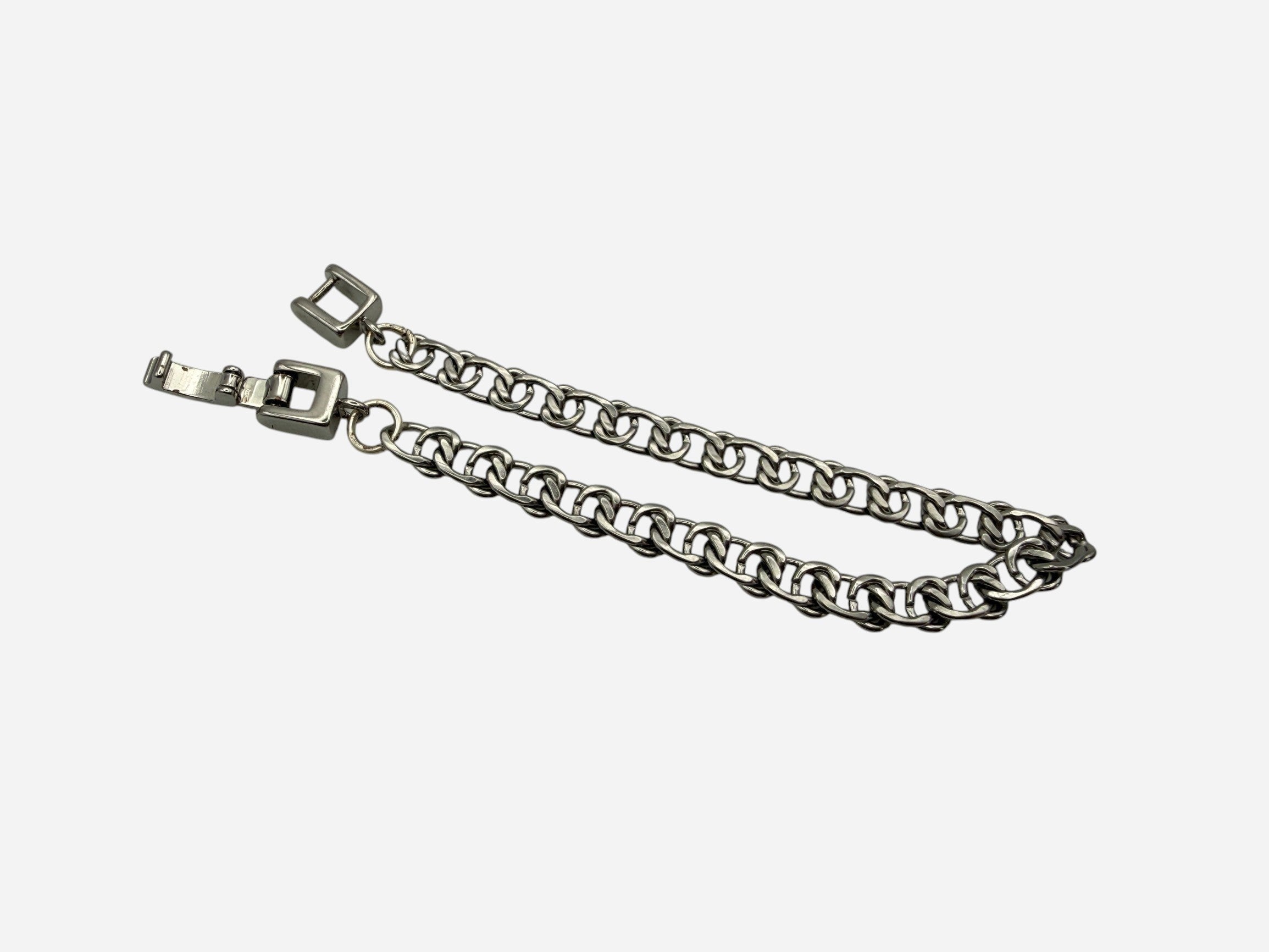 SPARQ silver-tone stainless steel double link chain bracelet with secure clasp closure.